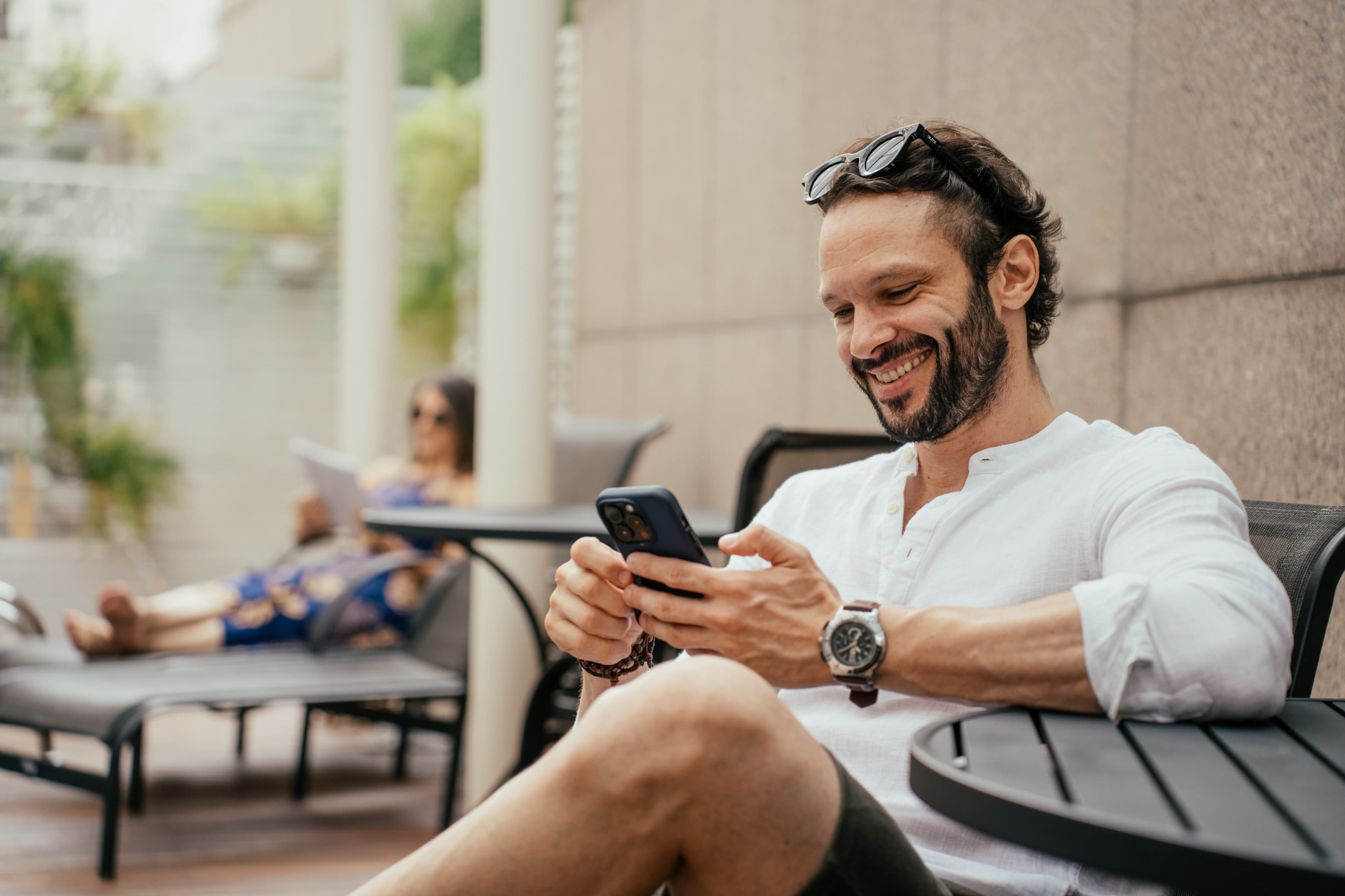 A lawyer smiling outdoors in a professional setting