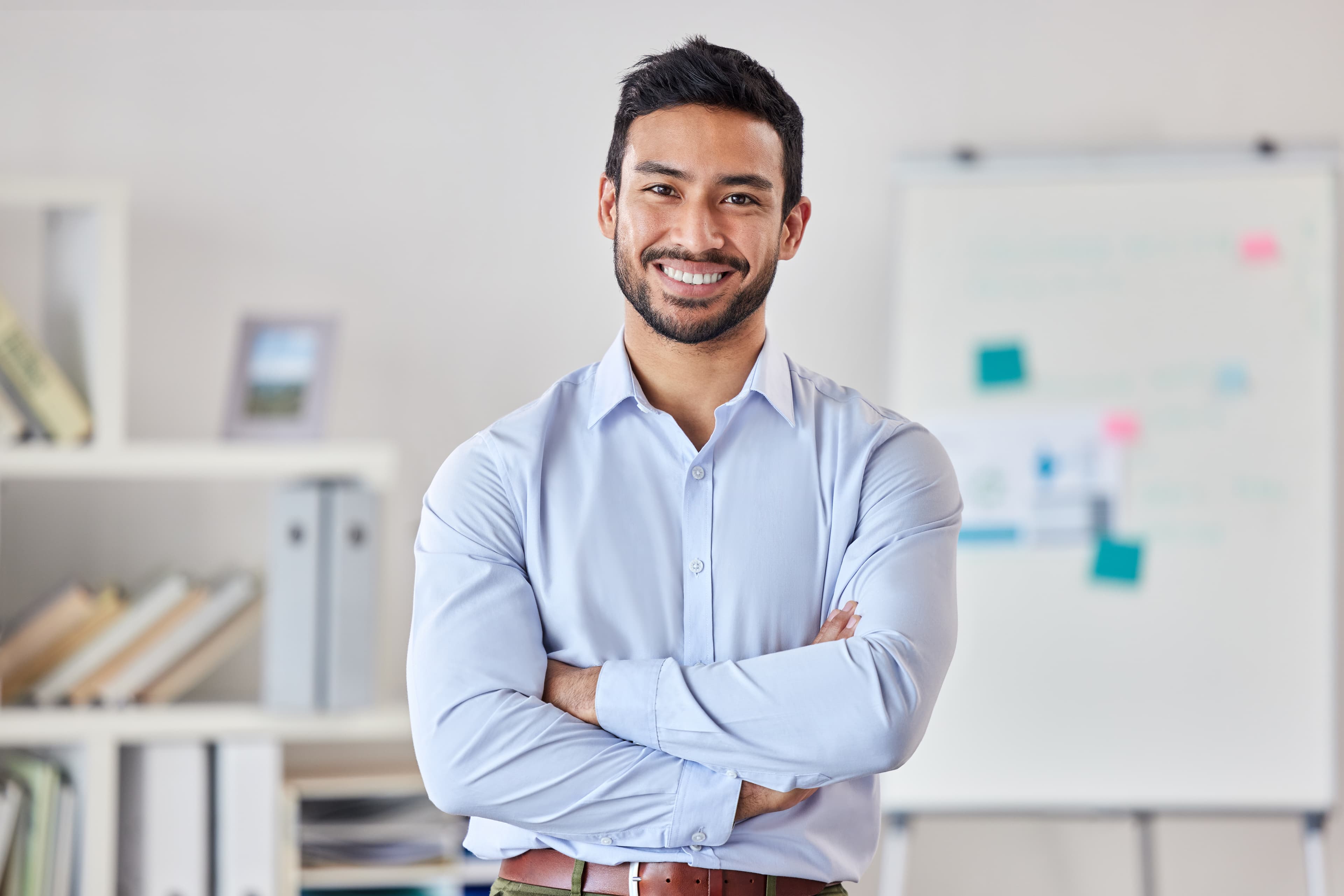 Law student smiling while studying case materials in a study room